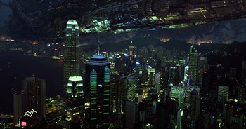Movie still from “Transformers: The Last Knight” (2017), directed by Michael Bay – An aerial view of a city lit up at night; Extreme Wide shot, High angle