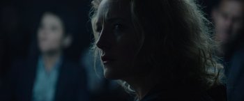 Movie still from “Troll” (2022), directed by Roar Uthaug – A woman's face in the dark; Close Up shot, Low angle