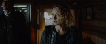 Movie still from “Troll” (2022), directed by Roar Uthaug – A woman in a black jacket is looking to her left; Close Up shot, Low angle