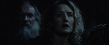 Movie still from “Troll” (2022), directed by Roar Uthaug – A person looking up at the sky; Close Up shot, Over the shoulder angle