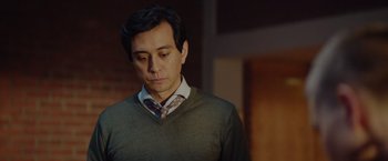 Movie still from “Troll” (2022), directed by Roar Uthaug – A person wearing a shirt and tie; Close Up shot, Low angle