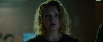 Movie still from “Troll” (2022), directed by Roar Uthaug – A person with curly blonde hair; Close Up shot, Low angle