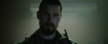 Movie still from “Troll” (2022), directed by Roar Uthaug – A person with a beard; Close Up shot, Low angle