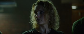 Movie still from “Troll” (2022), directed by Roar Uthaug – A person with curly hair; Close Up shot, Low angle