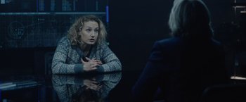 Movie still from “Troll” (2022), directed by Roar Uthaug – A woman sitting at a table talking to another woman; Medium shot, Over the shoulder angle