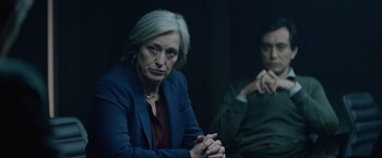 Movie still from “Troll” (2022), directed by Roar Uthaug – An older woman sitting next to a younger man; Medium shot, Over the shoulder angle