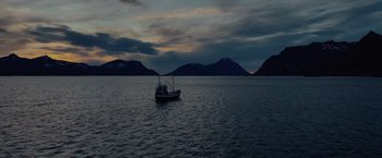 Movie still from “Troll” (2022), directed by Roar Uthaug – A small boat floating on top of a body of water; Extreme Wide shot, High angle