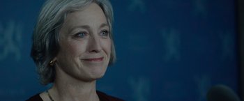 Movie still from “Troll” (2022), directed by Roar Uthaug – A person with short grey hair; Close Up shot, Low angle