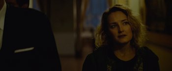 Movie still from “Troll” (2022), directed by Roar Uthaug – A woman standing next to a man in front of a window; Close Up shot, Over the shoulder angle