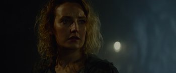 Movie still from “Troll” (2022), directed by Roar Uthaug – A person wearing a black shirt; Close Up shot, Over the shoulder angle