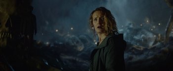 Movie still from “Troll” (2022), directed by Roar Uthaug – A woman standing in front of a city at night; Close Up shot, Low angle