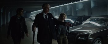 Movie still from “Troll” (2022), directed by Roar Uthaug – A man and a woman walking in a parking garage; Medium shot, Low angle