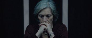 Movie still from “Troll” (2022), directed by Roar Uthaug – An older woman sitting in front of a window; Close Up shot, High angle