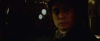 Movie still from “Troll” (2022), directed by Roar Uthaug – A person wearing a hat; Close Up shot, Low angle