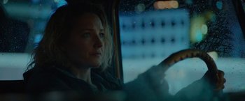 Movie still from “Troll” (2022), directed by Roar Uthaug – A woman sitting in a car looking out the window; Close Up shot, Low angle