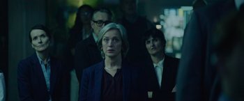 Movie still from “Troll” (2022), directed by Roar Uthaug – A group of people standing in the dark; Medium shot, Low angle