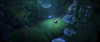 Movie still from “Trolls World Tour” (2020), directed by Walt Dohrn – An underwater scene with a large rock in the middle of the floor; Wide shot, High angle