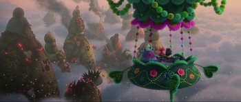 Movie still from “Trolls World Tour” (2020), directed by Walt Dohrn – A group of people sitting on top of a balloon; Extreme Wide shot, High angle