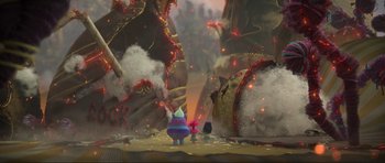 Movie still from “Trolls World Tour” (2020), directed by Walt Dohrn – An image of an animated scene with fire and smoke coming out; Extreme Wide shot, High angle