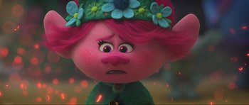 Movie still from “Trolls World Tour” (2020), directed by Walt Dohrn – The face of a troll doll; Close Up shot, Over the shoulder angle