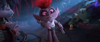 Movie still from “Trolls World Tour” (2020), directed by Walt Dohrn – A troll doll with a red mohawk and fishnet stockings; Medium shot, Over the shoulder angle