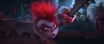 Movie still from “Trolls World Tour” (2020), directed by Walt Dohrn – The head of a troll with a chainsaw in the background; Close Up shot, Low angle