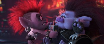 Movie still from “Trolls World Tour” (2020), directed by Walt Dohrn – A couple of people that are eating some food together; Medium shot, Over the shoulder angle