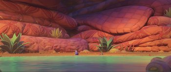 Movie still from “Trolls World Tour” (2020), directed by Walt Dohrn – An image of an animated scene with a person sitting in the water; Extreme Wide shot, High angle