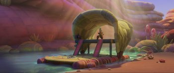 Movie still from “Trolls World Tour” (2020), directed by Walt Dohrn – A scene of a cartoon setting with a bridge and stairs leading up to it; Extreme Wide shot, High angle