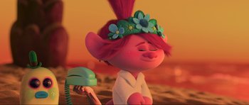 Movie still from “Trolls World Tour” (2020), directed by Walt Dohrn – A pink haired girl with flowers on her head; Close Up shot, Over the shoulder angle