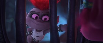 Movie still from “Trolls World Tour” (2020), directed by Walt Dohrn – A stuffed animal with red hair; Close Up shot, High angle