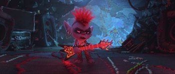 Movie still from “Trolls World Tour” (2020), directed by Walt Dohrn – A toy with a red mohawk is holding an electric guitar; Medium shot, Over the shoulder angle