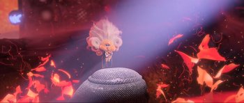 Movie still from “Trolls World Tour” (2020), directed by Walt Dohrn – A stuffed animal is on top of a hat; Wide shot, Low angle