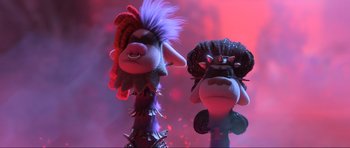 Movie still from “Trolls World Tour” (2020), directed by Walt Dohrn – A couple of stuffed animals that are next to each other; Close Up shot, Low angle