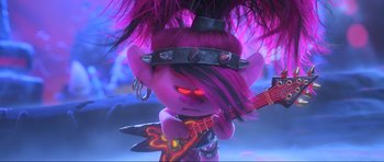Movie still from “Trolls World Tour” (2020), directed by Walt Dohrn – A troll with purple hair holding a guitar; Medium shot, High angle