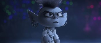 Movie still from “Trolls World Tour” (2020), directed by Walt Dohrn – A doll with a mohawk hair style; Close Up shot, High angle