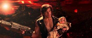 Movie still from “Tropic Thunder” (2008), directed by Ben Stiller – A man holding a baby in his arms; Medium shot, High angle