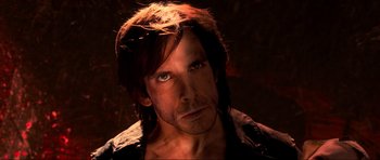 Movie still from “Tropic Thunder” (2008), directed by Ben Stiller – A person with long brown hair; Close Up shot, Low angle