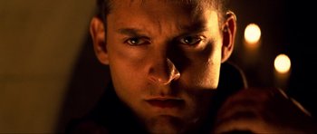 Movie still from “Tropic Thunder” (2008), directed by Ben Stiller – A man's face in the dark; Close Up shot, Low angle