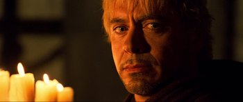 Movie still from “Tropic Thunder” (2008), directed by Ben Stiller – A man's face in the dark; Close Up shot, Over the shoulder angle