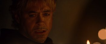 Movie still from “Tropic Thunder” (2008), directed by Ben Stiller – A man's face in a dark room; Close Up shot, Over the shoulder angle