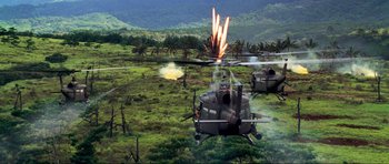 Movie still from “Tropic Thunder” (2008), directed by Ben Stiller – A group of military helicopters flying over a field; Extreme Wide shot, High angle