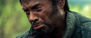 Movie still from “Tropic Thunder” (2008), directed by Ben Stiller – A person with a beard; Close Up shot, Low angle