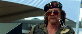 Movie still from “Tropic Thunder” (2008), directed by Ben Stiller – A person wearing sunglasses and a hat; Close Up shot, Low angle