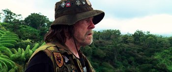 Movie still from “Tropic Thunder” (2008), directed by Ben Stiller – A person wearing a hat; Close Up shot, Over the shoulder angle