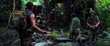 Movie still from “Tropic Thunder” (2008), directed by Ben Stiller – A group of men standing on top of a tree; Wide shot, High angle