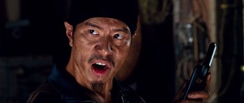 Movie still from “Tropic Thunder” (2008), directed by Ben Stiller – A person wearing a hat; Close Up shot, Over the shoulder angle