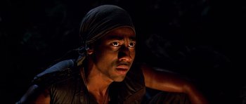 Movie still from “Tropic Thunder” (2008), directed by Ben Stiller – A person wearing a headscarf; Close Up shot, Low angle