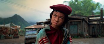 Movie still from “Tropic Thunder” (2008), directed by Ben Stiller – A person wearing a red hat and a red jacket; Close Up shot, Low angle