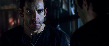 Movie still from “Tropic Thunder” (2008), directed by Ben Stiller – A person wearing a black shirt; Close Up shot, Over the shoulder angle